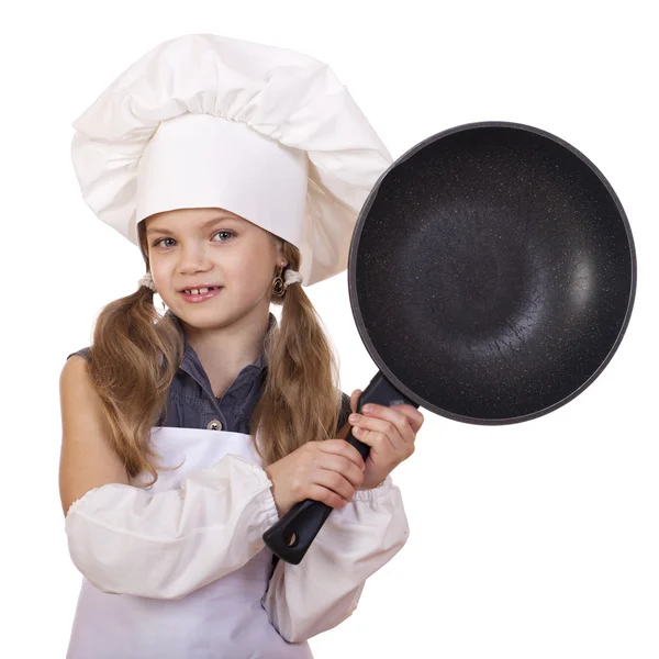 Menina sorridente em chapéu de cozinheiro com frigideira — Fotografia de Stock