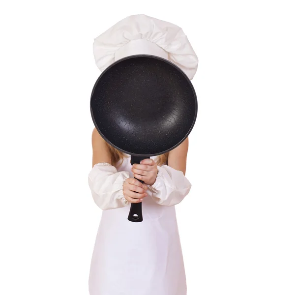 Menina em chapéu de cozinheiro com frigideira — Fotografia de Stock