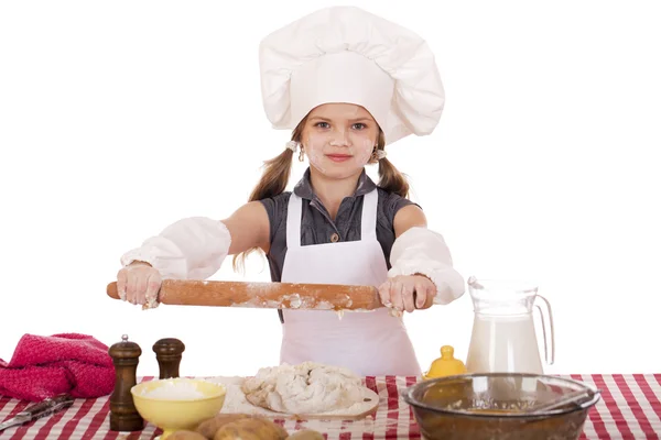 Carino bambina cottura in cucina e mostra mattarello, isolato su uno sfondo bianco — Foto Stock