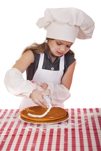 Beautiful happy seven year old girl in chef uniform with shortca — Stock Photo, Image