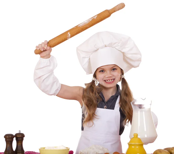 Linda niña horneando en la cocina y muestra rodillo, aislado sobre un fondo blanco — Foto de Stock