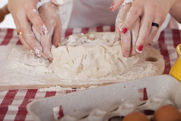 Close up hands of family are baking cakes in home kitchen — Stock Photo, Image