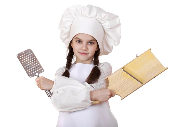 Beautiful little girl in a white apron and holding a wooden grat — Stock Photo, Image