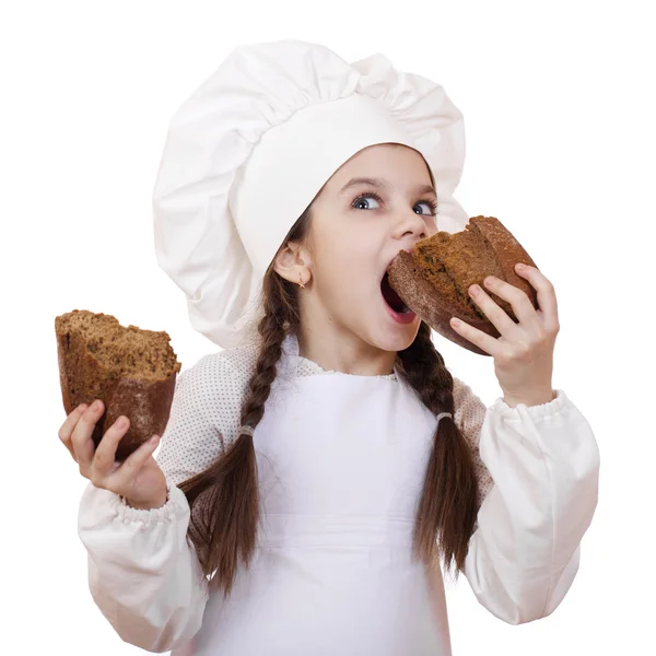 Cooking and people concept - smiling little girl in cook hat — Stock Photo, Image