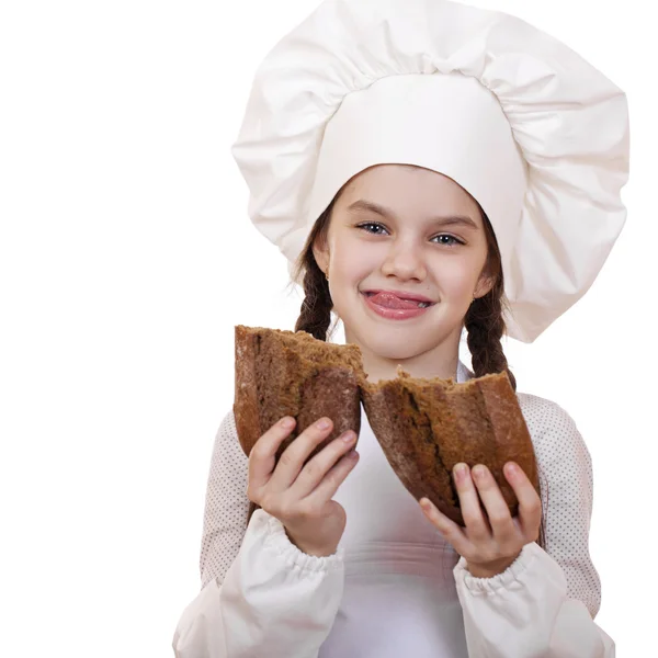 Cocina y concepto de la gente - niña sonriente en sombrero de cocinero — Foto de Stock