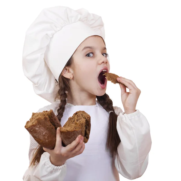 Cocina y concepto de la gente - niña sonriente en sombrero de cocinero — Foto de Stock