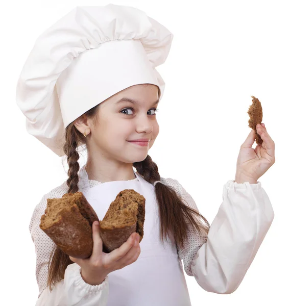 Cozinhar e conceito de pessoas - menina sorridente em chapéu de cozinheiro — Fotografia de Stock