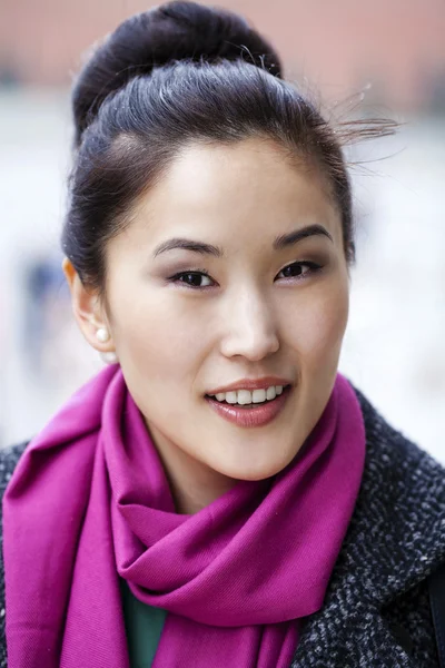 Young Asian woman walking on spring city in Russia