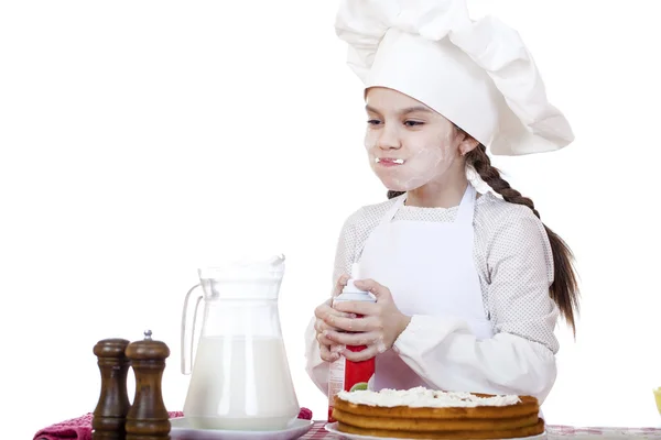 Matlagning och människor koncept - leende liten flicka i cook mössa — Stockfoto