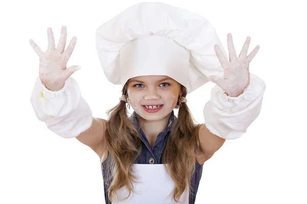 Bonito menina assar na cozinha e mostra as mãos — Fotografia de Stock