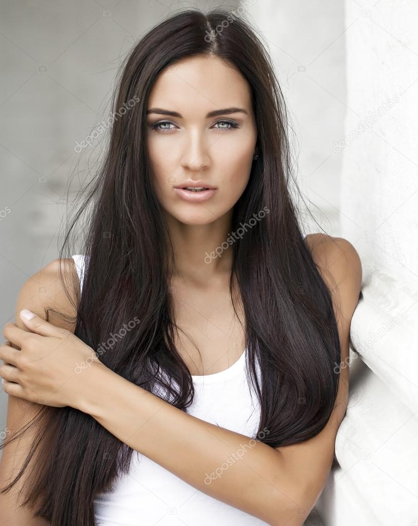 Young beautiful woman in white dress