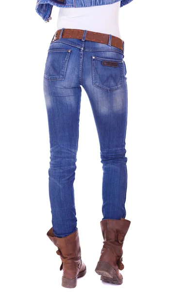 Visão traseira de uma longa mulher pernas posando com jeans — Fotografia de Stock