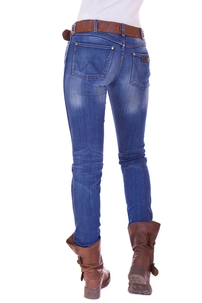 Achteraanzicht van de benen van een lange vrouw poseren met jeans Rechtenvrije Stockfoto's