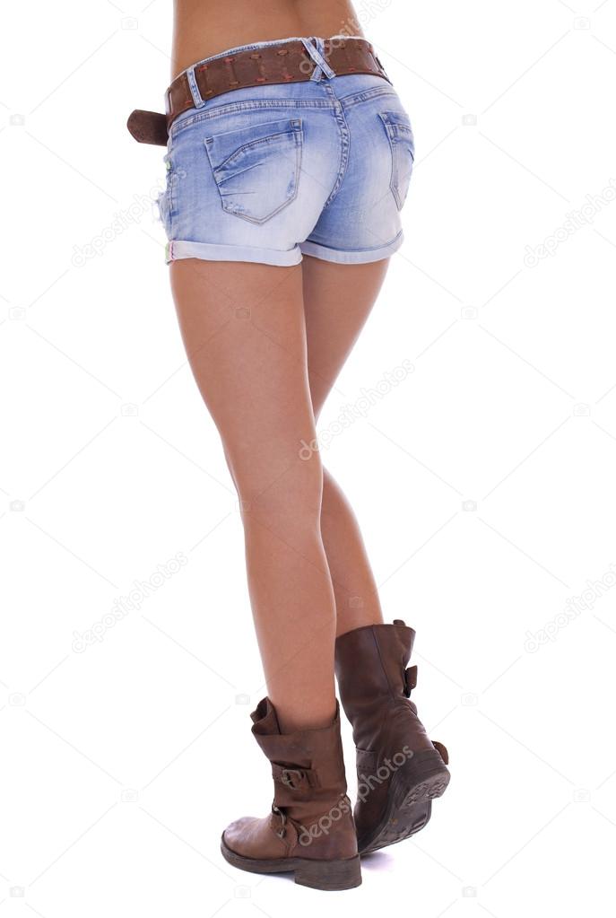 Woman in jeans texas shorts. Young tanned woman wearing blue sho