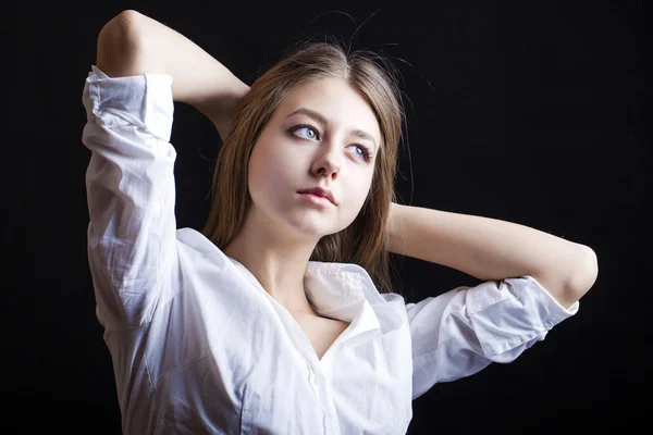 Portrait of beautiful young woman in white shirt — Stock Photo, Image