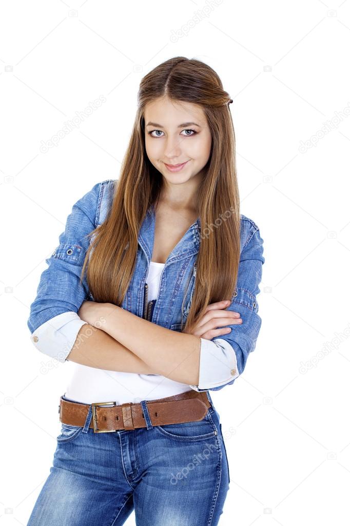 Portrait of a young girl teenager in jeans jacket and blue jeans