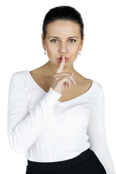 Portrait of attractive teenage girl with finger on lips — Stock Photo, Image