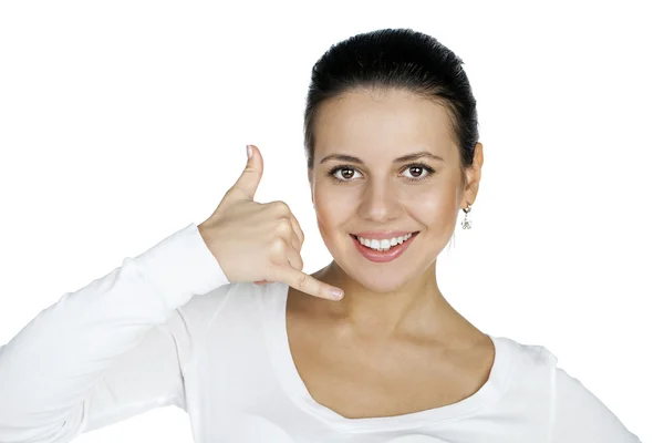 Young happy smiling brunette woman with call me gesture Stock Picture