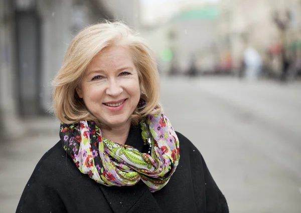 Happy portrait of an elderly blonde woman — Stock Photo, Image