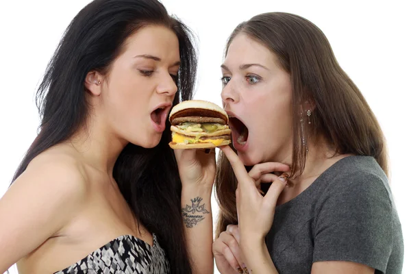 Two girls divide one sandwich — Stock Photo, Image