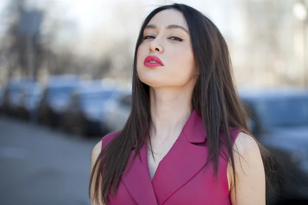 Beautiful young woman in red dress — Stock Photo, Image