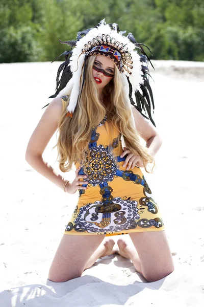 Blonde woman in costume of American Indian — Stock Photo, Image