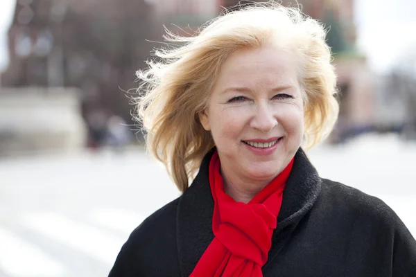 Happy portrait of an elderly blonde woman — Stock Photo, Image