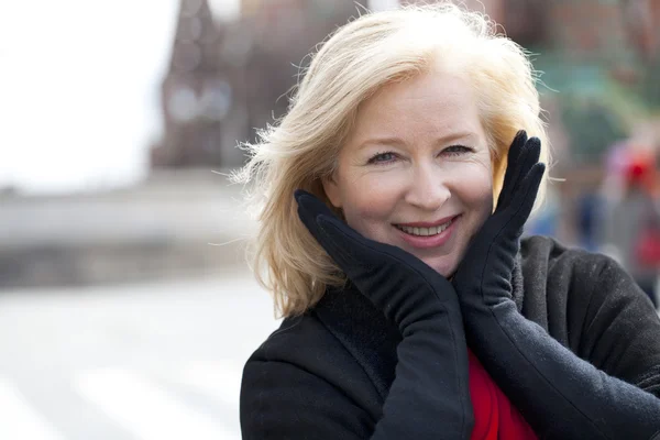 Happy portrait of an elderly blonde woman — Stock Photo, Image