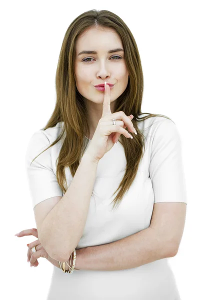 Portrait of attractive teenage girl with finger on lips — Stock Photo, Image