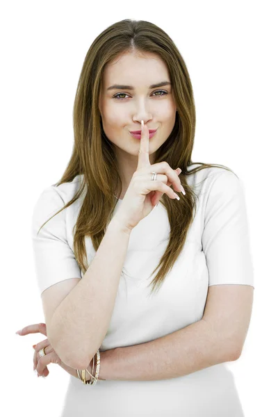 Portrait of attractive teenage girl with finger on lips — Stock Photo, Image