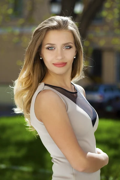 Portrait close up of young beautiful blonde woman, on background — Stock Photo, Image