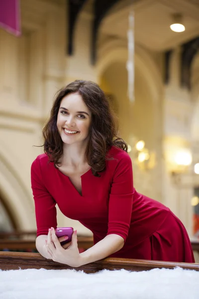 Cheerful young woman calling by phone — Stock Photo, Image