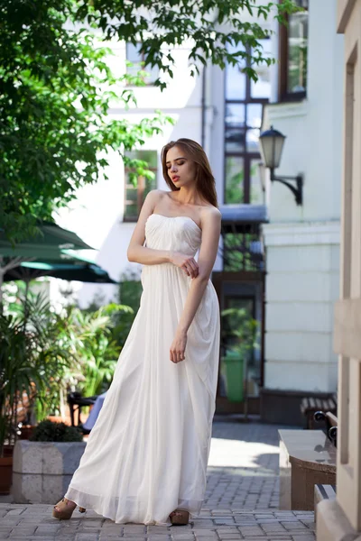 Full length portrait of beautiful model woman in white dress Stock Image