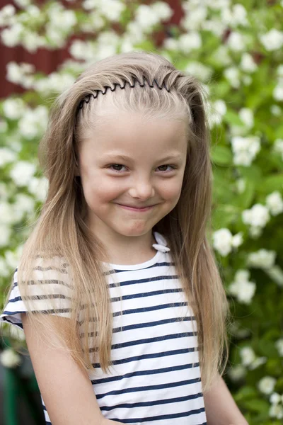 Close up portrait of a seven year little girl, against backgroun — Stock Photo, Image