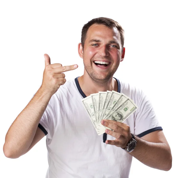 Happy young man holding a pile of cash — ストック写真