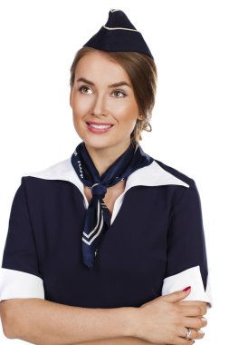 Beyaz bir arka plan üzerinde izole güzel gülümseyen hostes