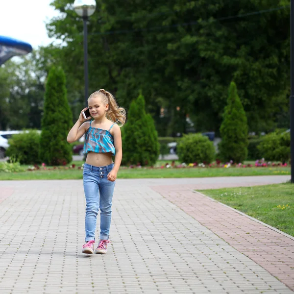 School girl calling by phone — Stock Photo, Image