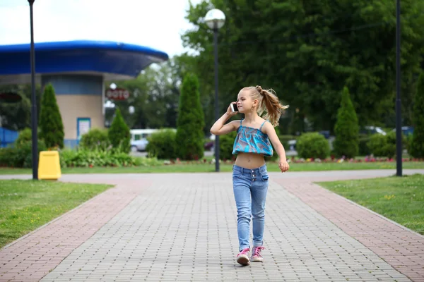School girl calling by phone — Stock Photo, Image