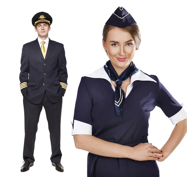 Captain of the aircraft and a beautiful flight attendant in a da — Stockfoto