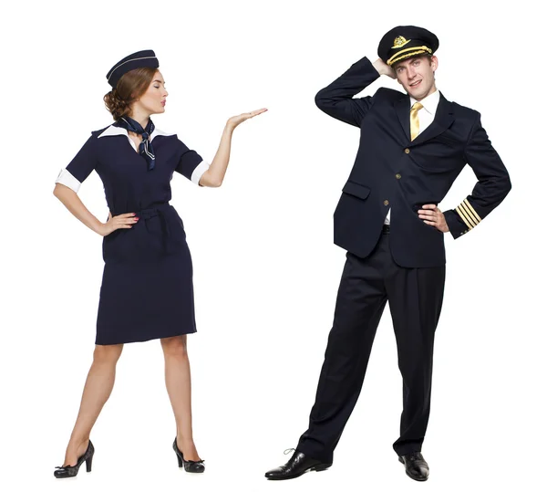 Captain of the aircraft and a beautiful flight attendant in a da — Stock Photo, Image