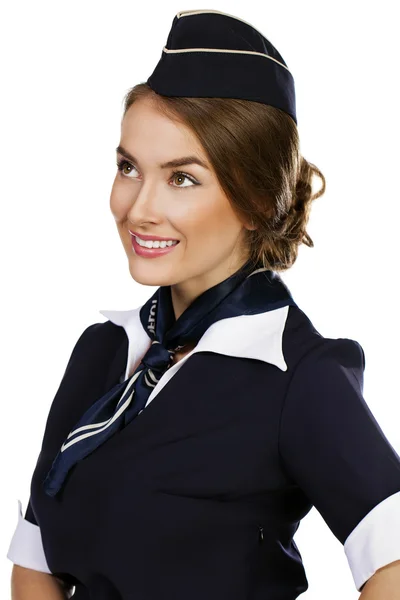 Schöne lächelnde Stewardess isoliert auf weißem Hintergrund — Stockfoto