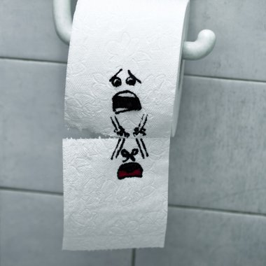 Roll of toilet paper and felt tip pen drawn funny faces clipart