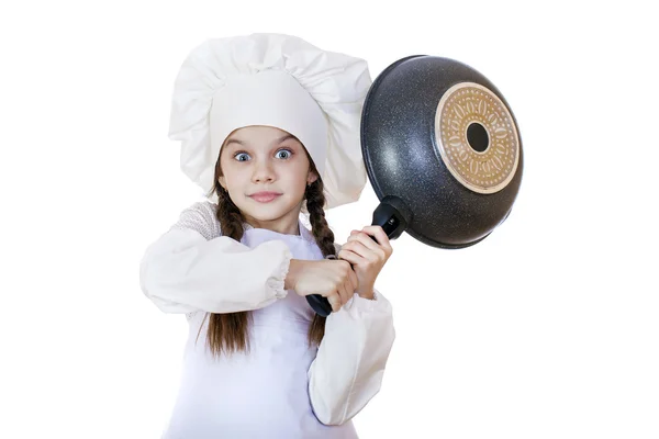 Lächelndes kleines Mädchen mit Kochmütze und Bratpfanne — Stockfoto