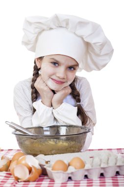 Beyaz bir önlük ve şef şapkasını, küçük kız TH hamur yoğurmak