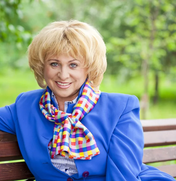 Portrait of an elderly beautiful woman in blue jacket — Φωτογραφία Αρχείου