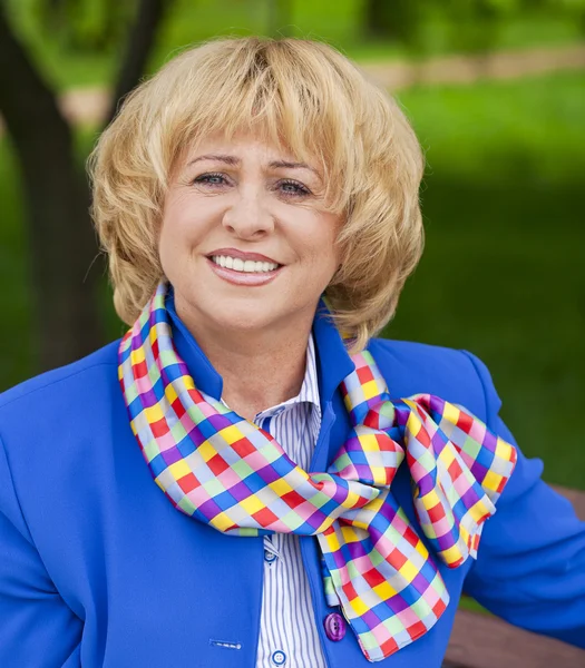 Portrait of an elderly beautiful woman in blue jacket — Φωτογραφία Αρχείου