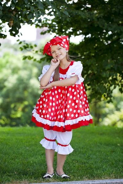 Portrait of a charming little girl looking at camera — Stock Photo, Image