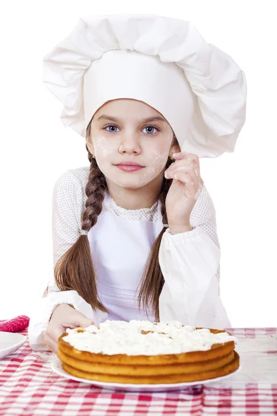 Cooking and people concept - smiling little girl in cook hat — Stock Photo, Image