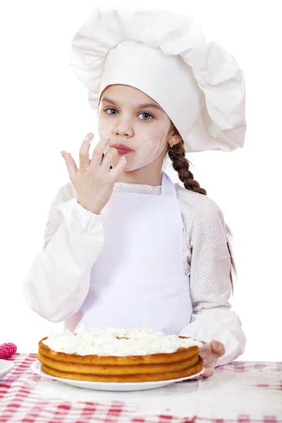 Matlagning och människor koncept - leende liten flicka i cook mössa — Stockfoto