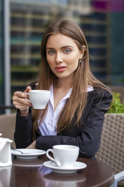 Happy Business woman in white shirt calling by phone